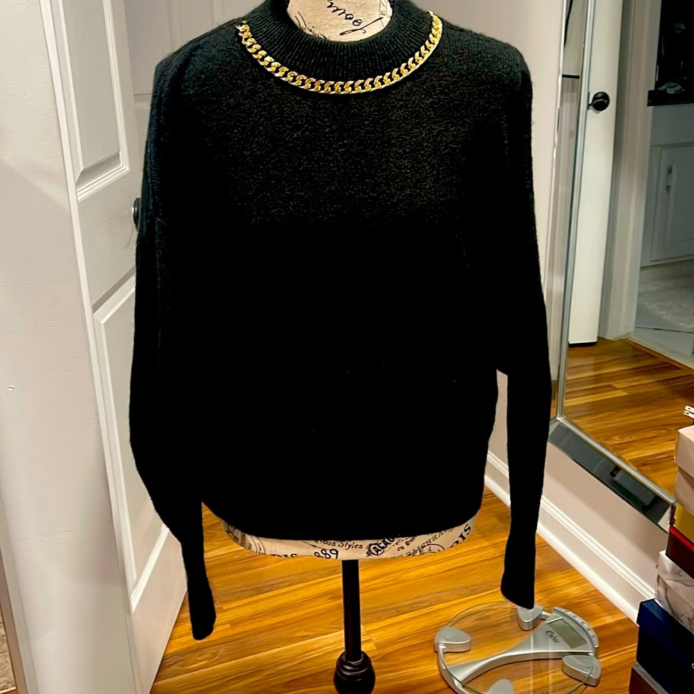 Black crew neck sweater chain detail